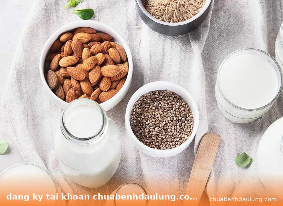 Hình ảnh flat lay các thực phẩm tốt cho sức khỏe bao gồm hạnh nhân, hạt chia và sữa - Đăng ký tài khoản chuabenhdaulung.com nhận code trải nghiệm chăm sóc sức khỏe